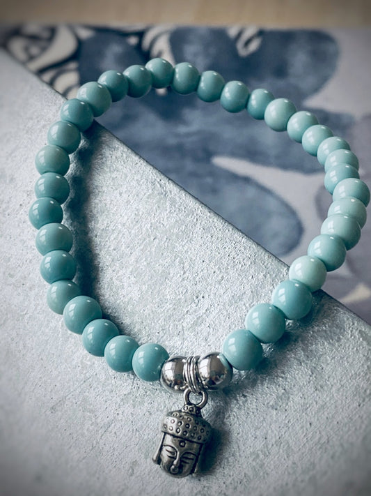 A588 - Hellblaue Glasperlen mit Buddha